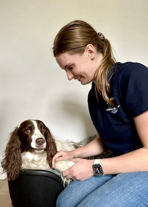 Alysia treating a spaniel